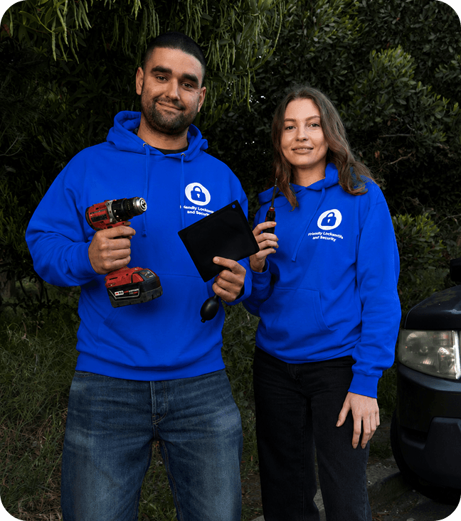 Friendly Locksmith and Security team beside their service vehicle