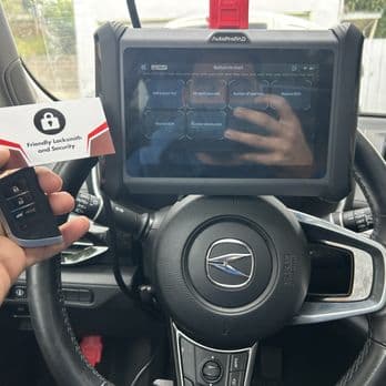Automotive key programming tablet inside a vehicle