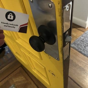 Yellow door latch and lock hardware after repair